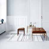 Brown solid color entryway bench with stitch-tufted padding
